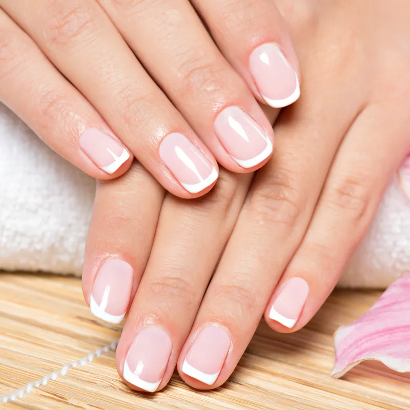 A woman with fresh nails from a Waterdown nail salon