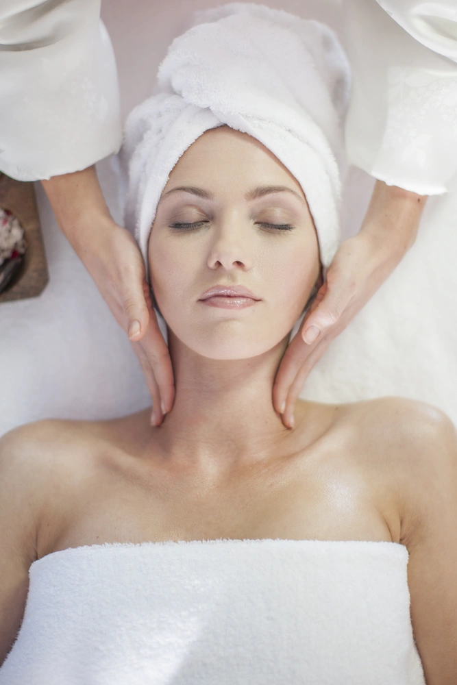 Woman receiving a facial at a spa in Waterdown