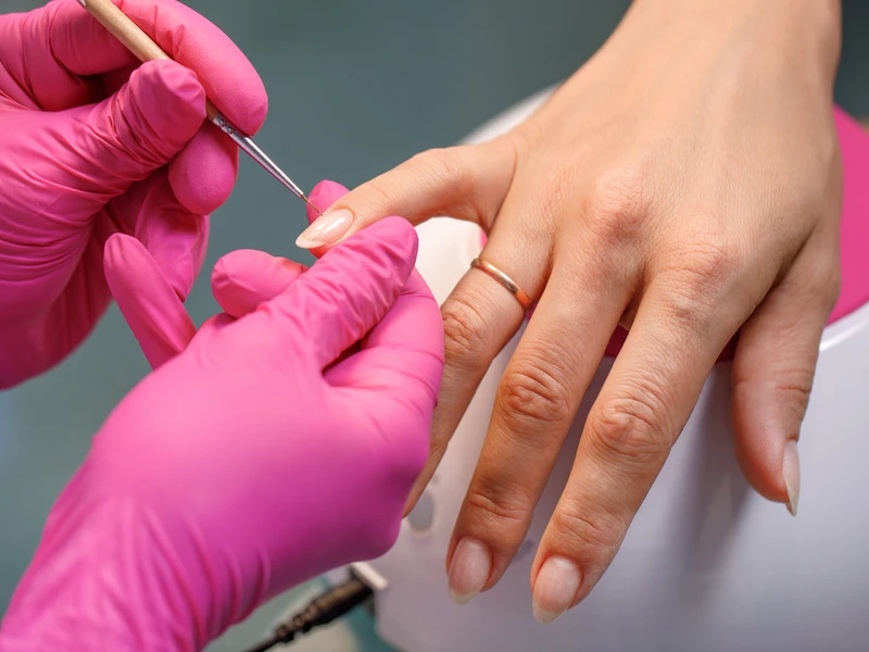 Woman receiving a nail manicure in Waterdown